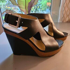 Pre-loved Michael Kors Black leather wedge sandals with brown trim. Size 9.5 M